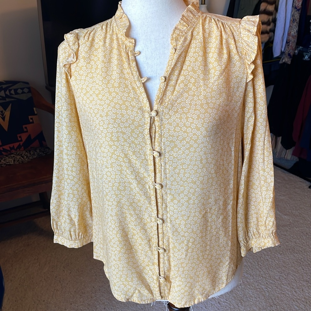 Long sleeved, ruffled blouse- pale yellow with white flowers